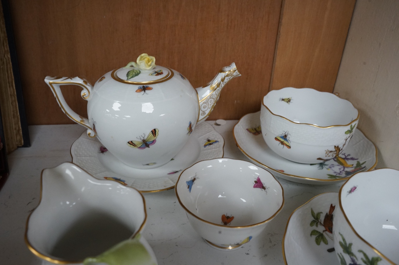 A Herend porcelain Rothschild Birds pattern tête-à-tête tea service, decorated with birds and butterflies. (8 piece's) teapot 10cm high